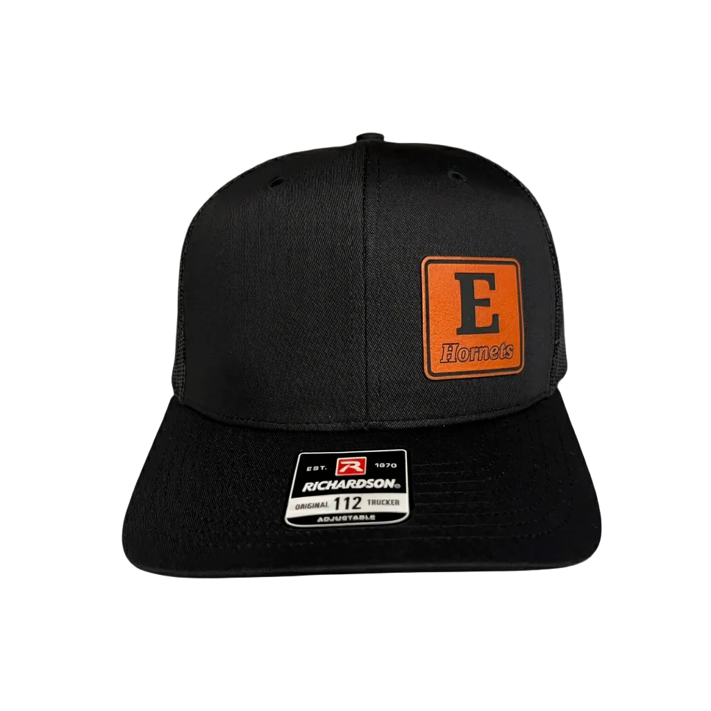 Black cap with orange and white logo on a light gray background