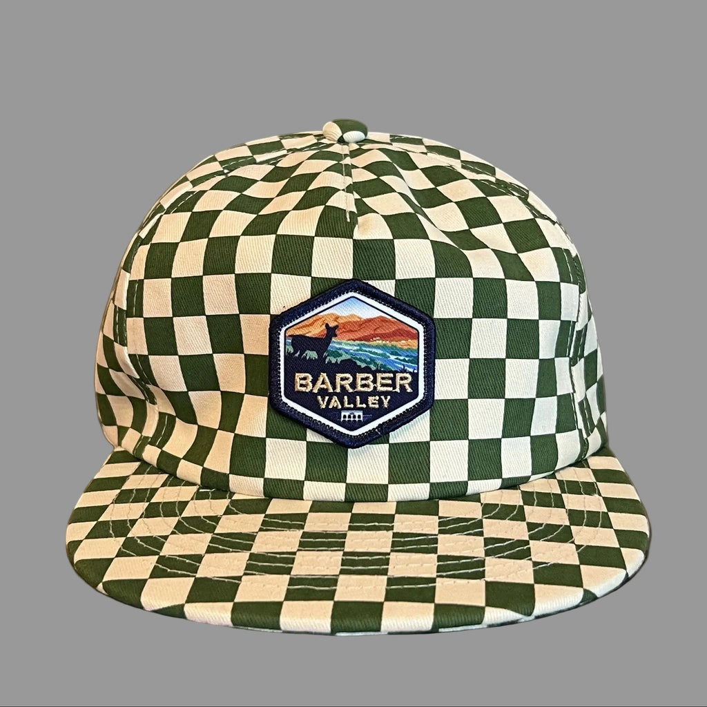 Barber Valley Threads green and white checkered snapback hat with a custom embroidered landscape patch on the front.