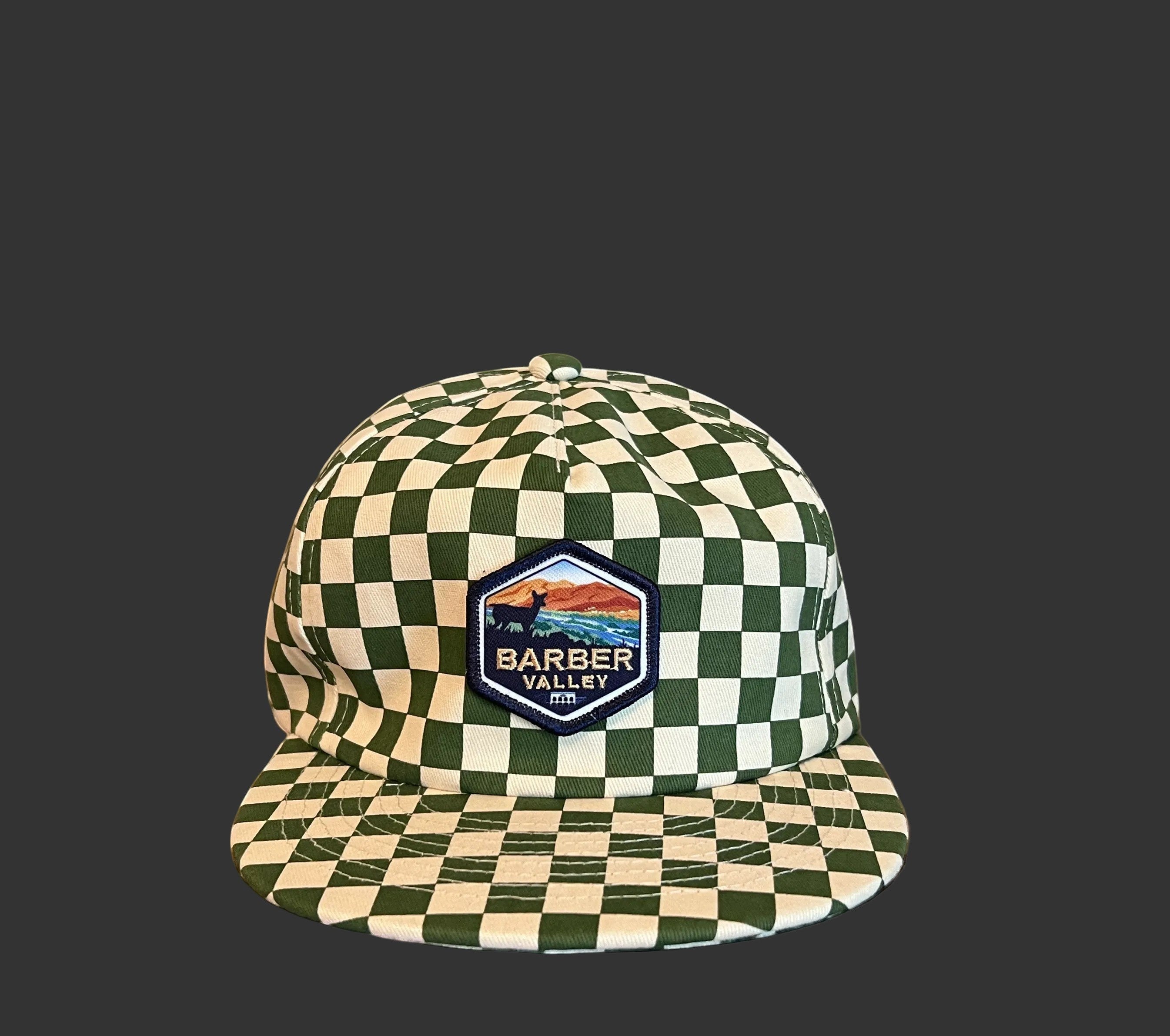 Barber Valley Threads green and white checkered snapback hat with a custom embroidered landscape patch on the front.